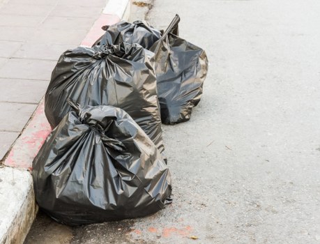 Residential waste bins in Chelsea neighborhood