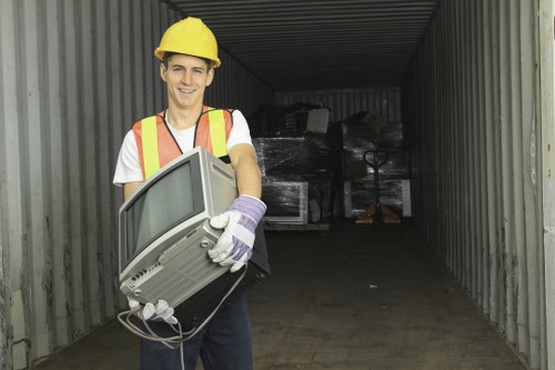 Professional clearance team removing office furniture